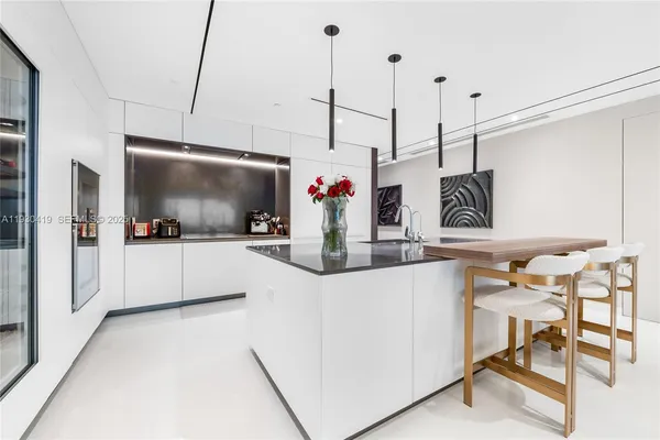 a view of a living room with furniture and a flat screen tv