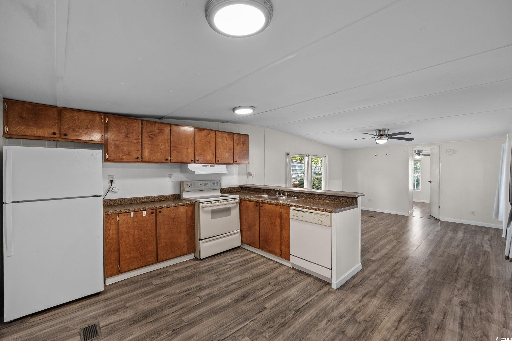 173 Braddock Court Murrells Inlet, SC 29576 - Photo 12 of 30 Kitchen with ceiling fan, sink, white appliances,