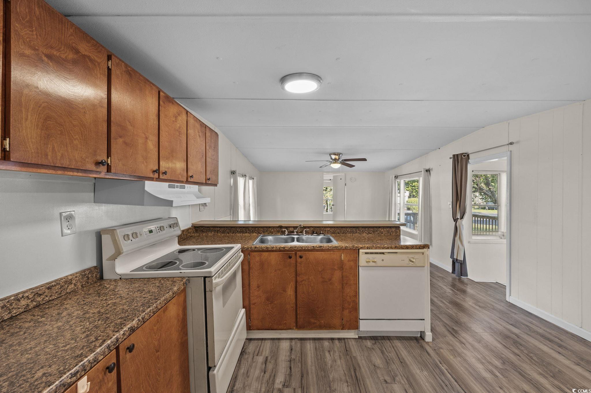 173 Braddock Court Murrells Inlet, SC 29576 - Photo 13 of 30 Kitchen with white appliances, dark hardwood / woo