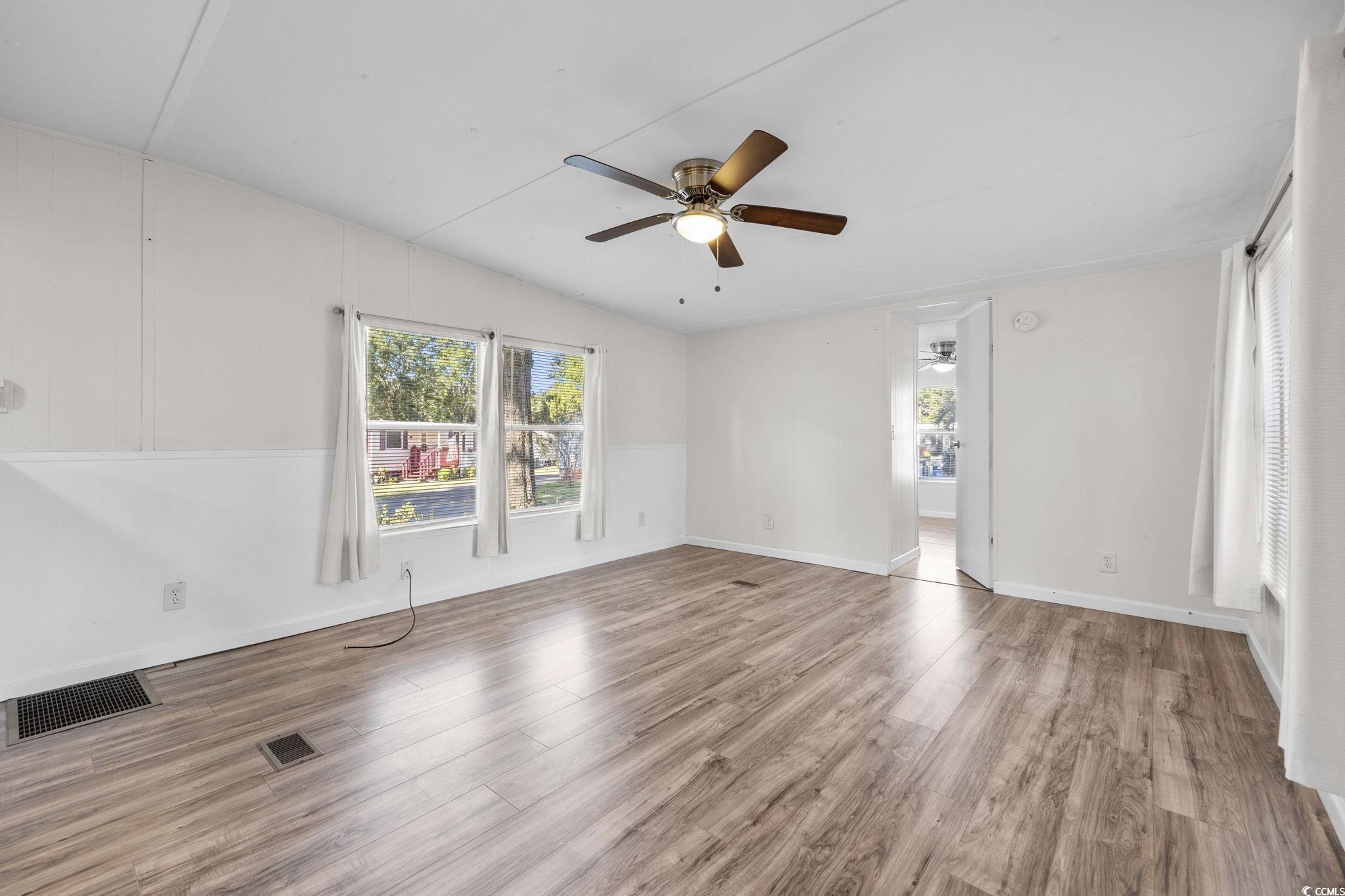 173 Braddock Court Murrells Inlet, SC 29576 - Photo 15 of 30 Spare room with ceiling fan, lofted ceiling, and h