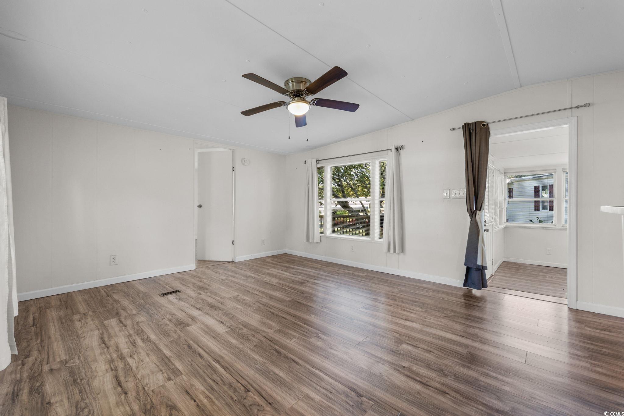 173 Braddock Court Murrells Inlet, SC 29576 - Photo 16 of 30 Unfurnished room with vaulted ceiling, ceiling fan