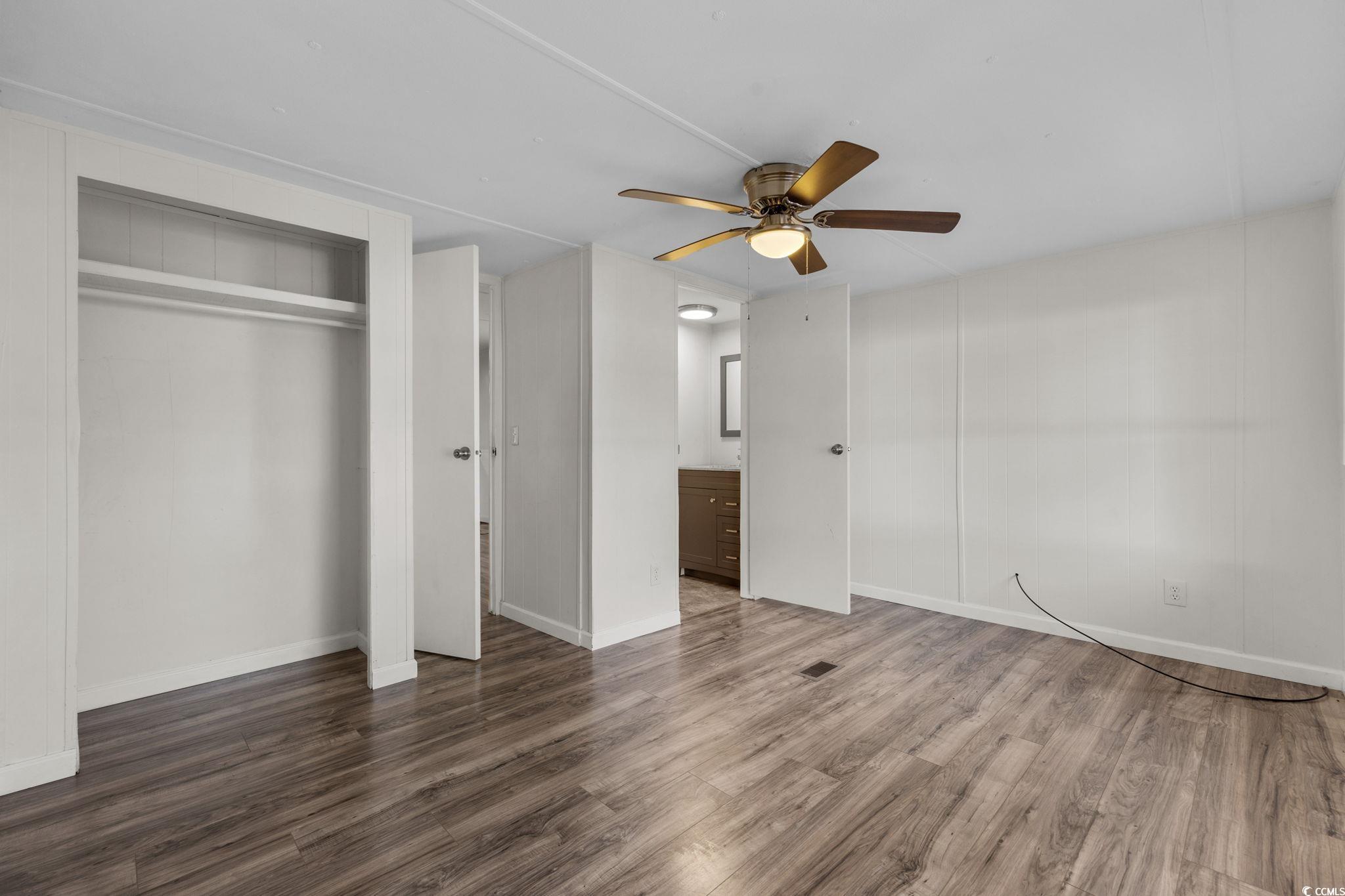 173 Braddock Court Murrells Inlet, SC 29576 - Photo 18 of 30 Unfurnished bedroom with a closet, ceiling fan, an