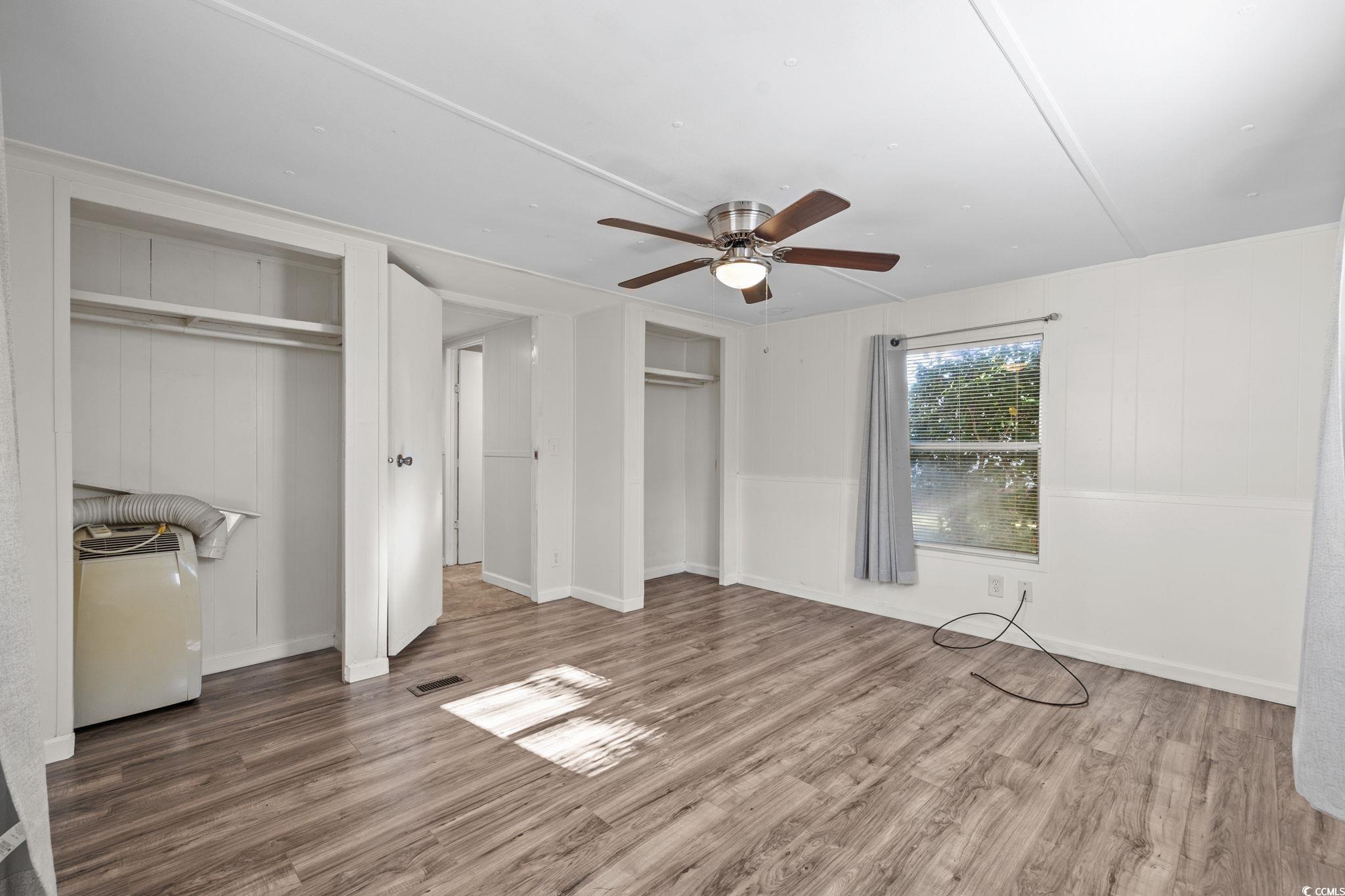 173 Braddock Court Murrells Inlet, SC 29576 - Photo 22 of 30 Unfurnished bedroom featuring ceiling fan, multipl