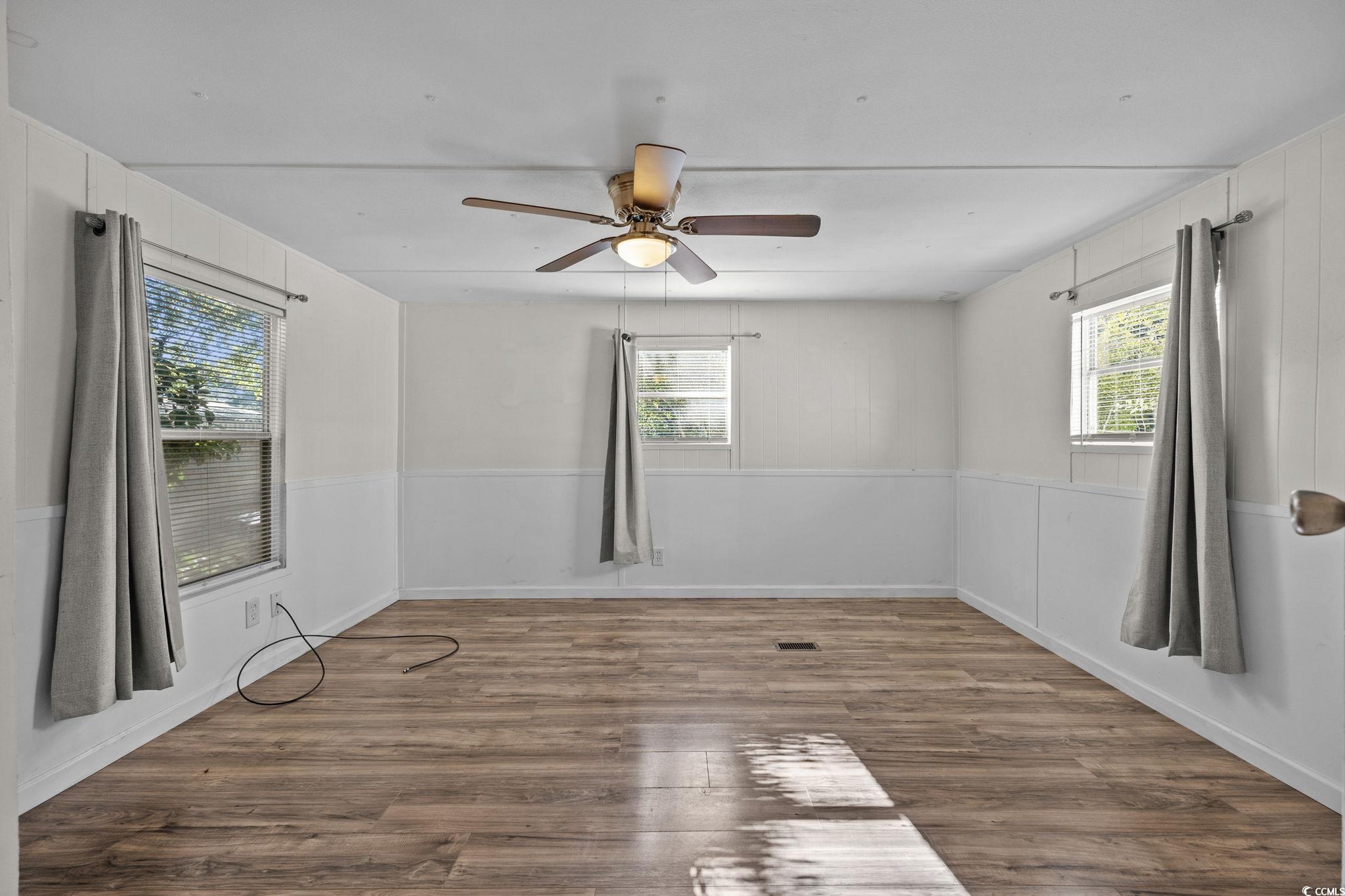 173 Braddock Court Murrells Inlet, SC 29576 - Photo 23 of 30 Spare room featuring wood-type flooring, plenty of