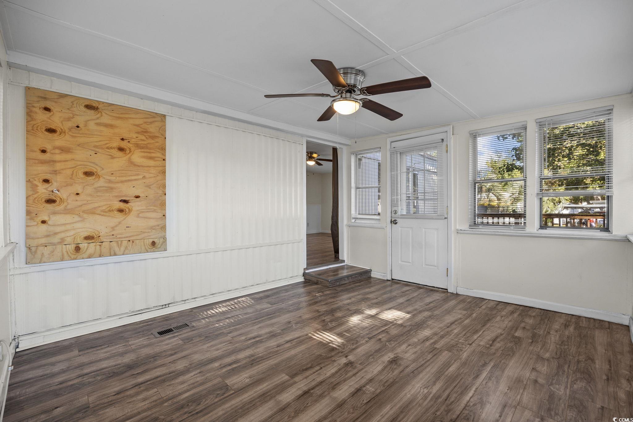 173 Braddock Court Murrells Inlet, SC 29576 - Photo 6 of 30 Spare room featuring ceiling fan and dark hardwood