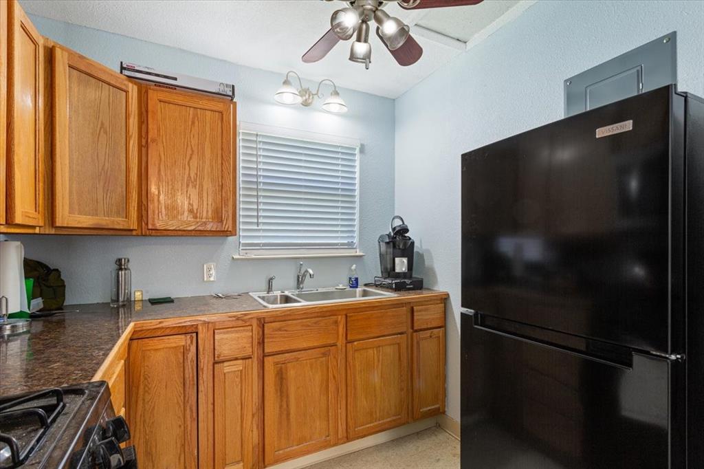 290 Fcr, Unit 481 Teague, TX 75860 - Photo 12 of 33 a kitchen with stainless steel appliances a sink cabinets and a window