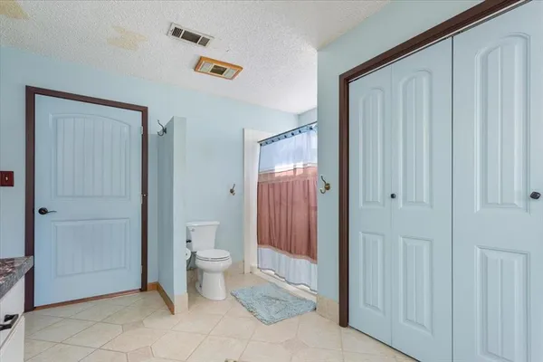 a bathroom with a toilet