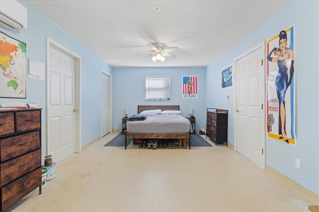 290 Fcr, Unit 481 Teague, TX 75860 - Photo 16 of 33 a bedroom with furniture and a chandelier