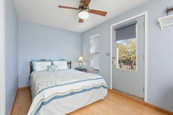 a bedroom with bed and window