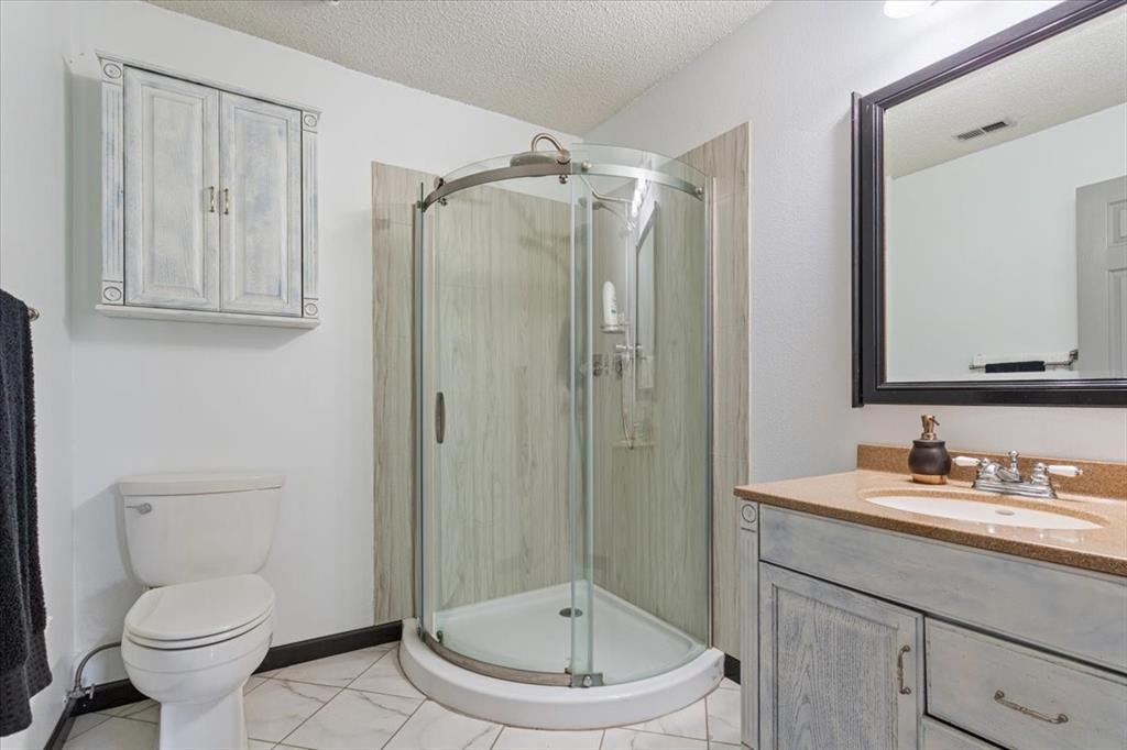 290 Fcr, Unit 481 Teague, TX 75860 - Photo 19 of 33 a bathroom with a toilet a sink and a mirror