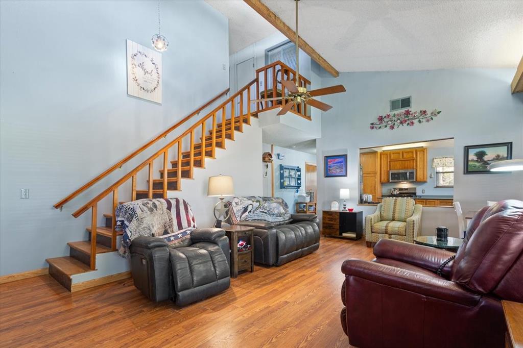 290 Fcr, Unit 481 Teague, TX 75860 - Photo 8 of 33 a living room with furniture or stairs and a wooden floor