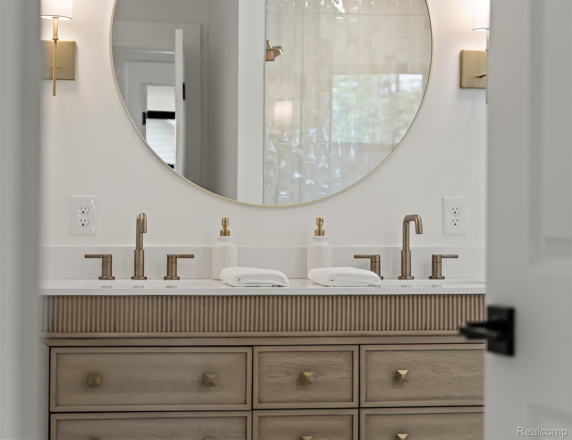 347 Highland Avenue Rochester, MI 48307 - Photo 33 of 59 Dual vanity featuring bronze-finish fixtures, a routed wood-finish base cabinet, and a white countertop