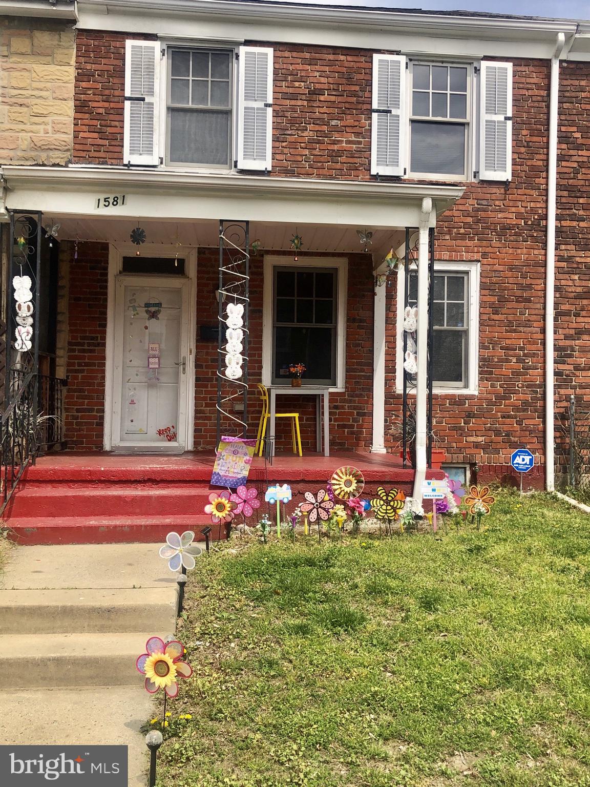1581 Minnesota Road Camden, NJ 08104 - Photo 1 of 16 front view of a brick house with a yard