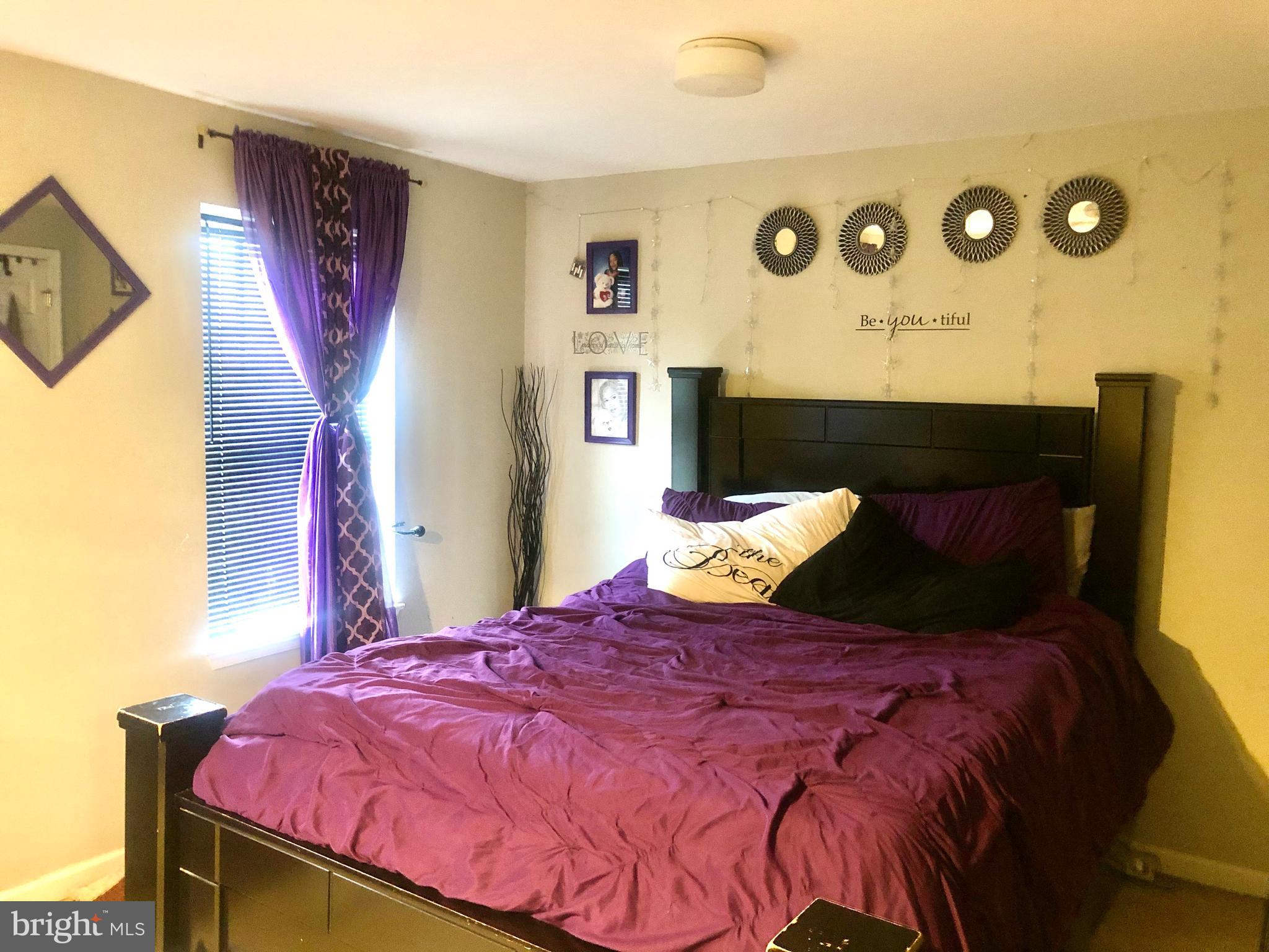 1581 Minnesota Road Camden, NJ 08104 - Photo 15 of 16 a bed sitting in a bedroom next to a window