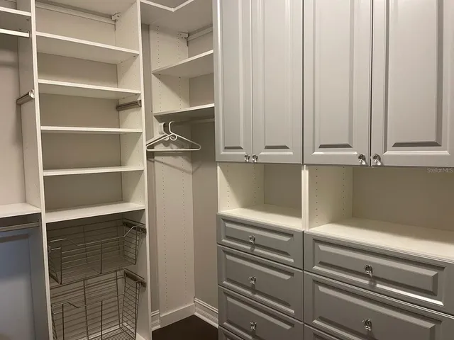 a view of storage and utility room with racks on the wall