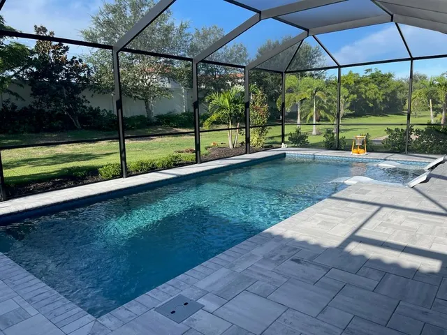 a view of backyard with green space and porch