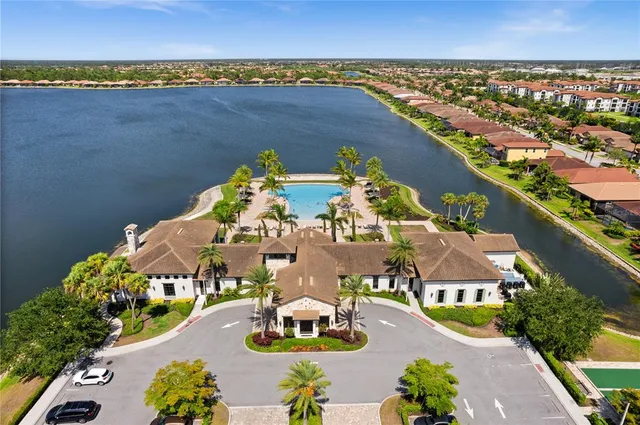 an aerial view of a house with a swimming pool yard and outdoor seating