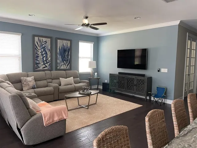 a living room with fireplace furniture and a flat screen tv