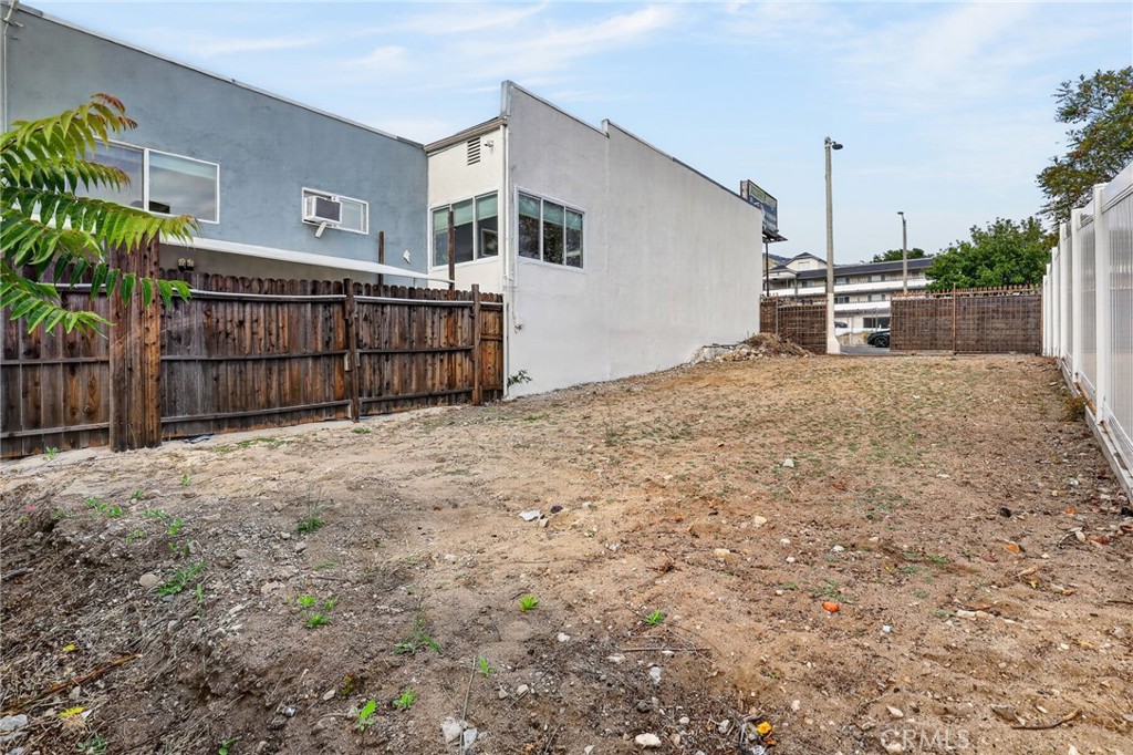 9939 Commerce Avenue Tujunga, CA 91042 - Photo 29 of 30 a view of a house with a backyard and garage