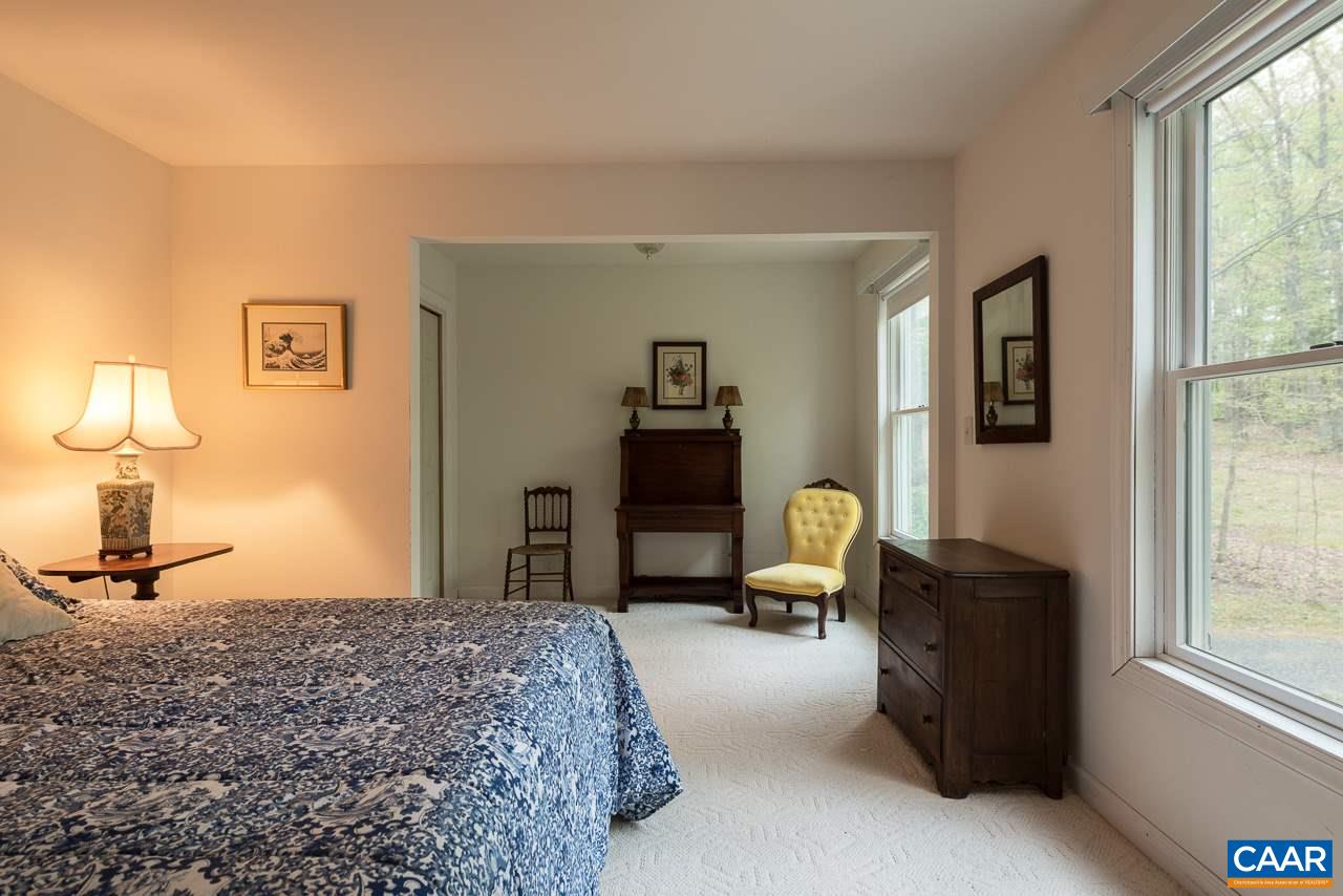 680 Broad Axe Road Charlottesville, VA 22903 - Photo 11 of 19 a bedroom with a bed couch and a window