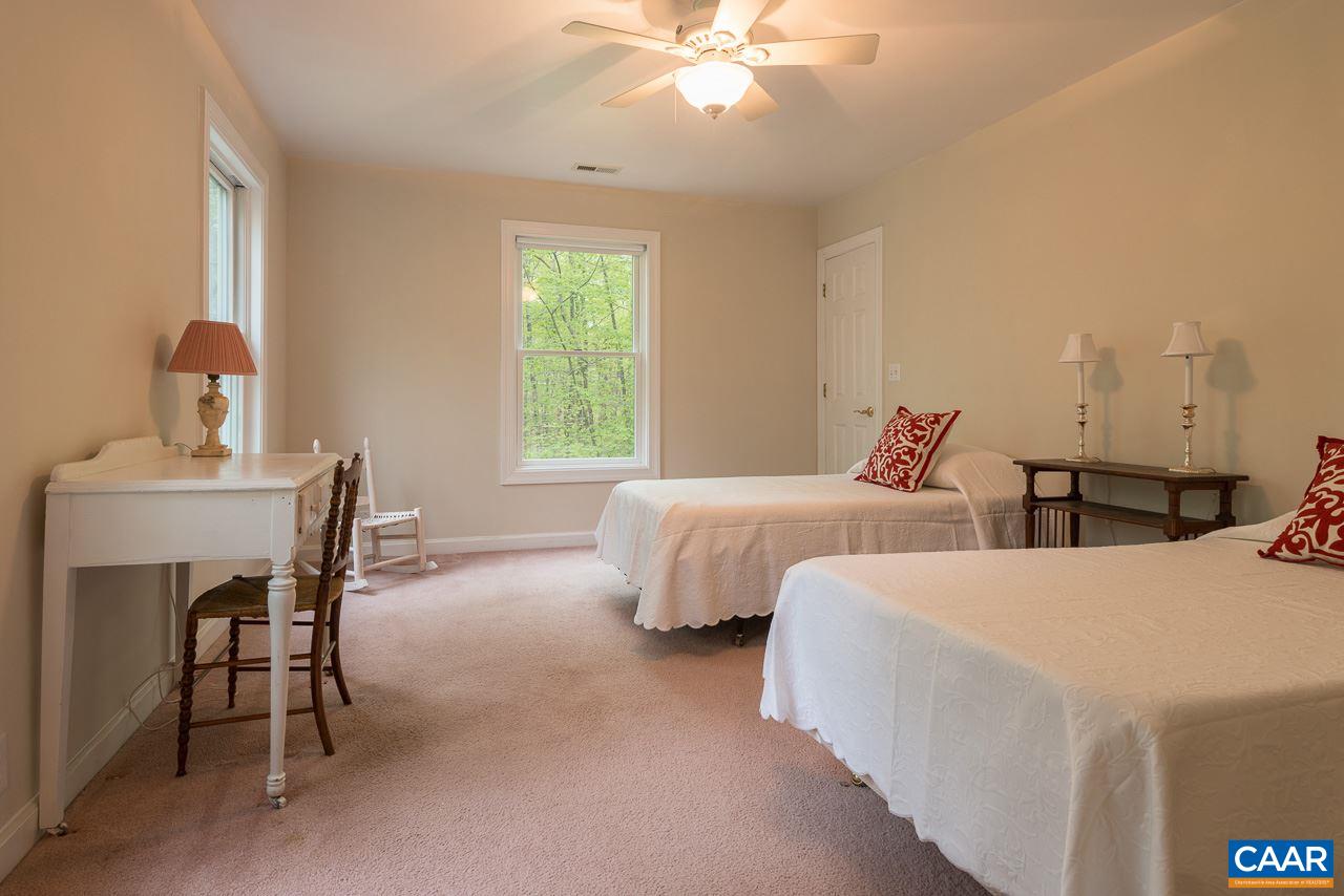 680 Broad Axe Road Charlottesville, VA 22903 - Photo 12 of 19 a bedroom with two beds and a table