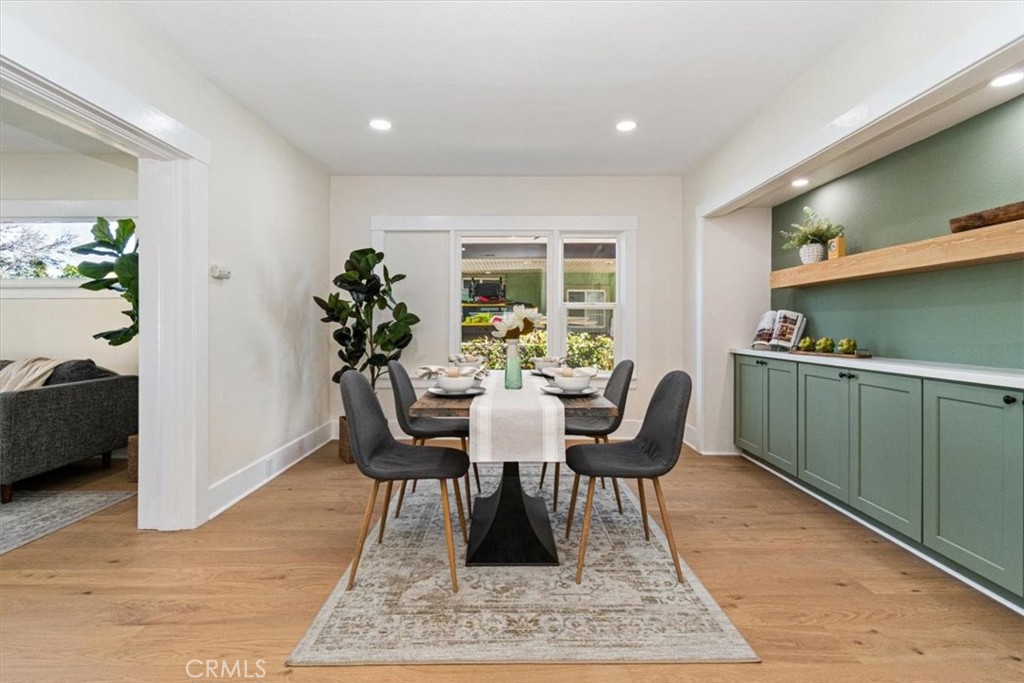 4474 Highland Place Riverside, CA 92506 - Photo 12 of 31 a dining room with furniture and wooden floor