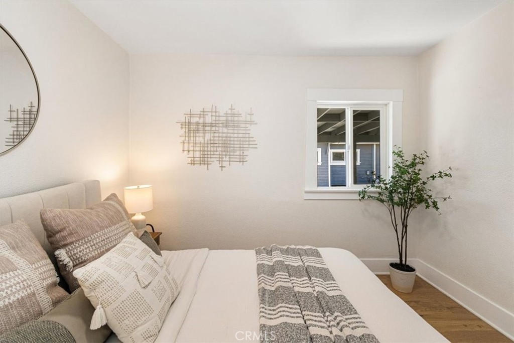 4474 Highland Place Riverside, CA 92506 - Photo 16 of 31 a bedroom with a bed and a window