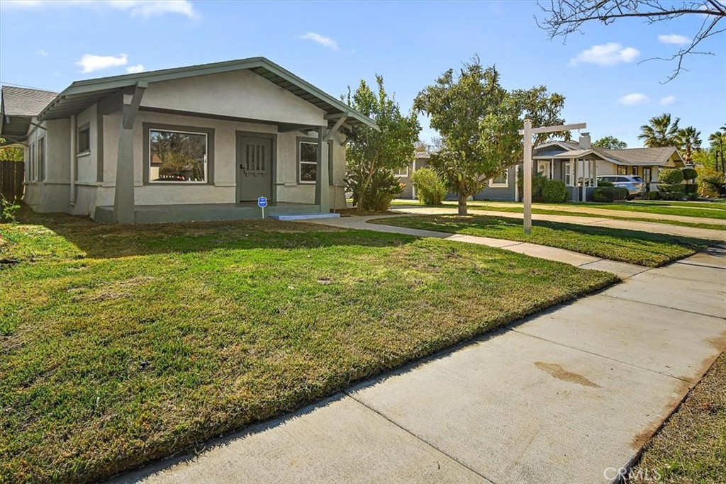 4474 Highland Place Riverside, CA 92506 - Photo 2 of 31 a front view of a house with garden