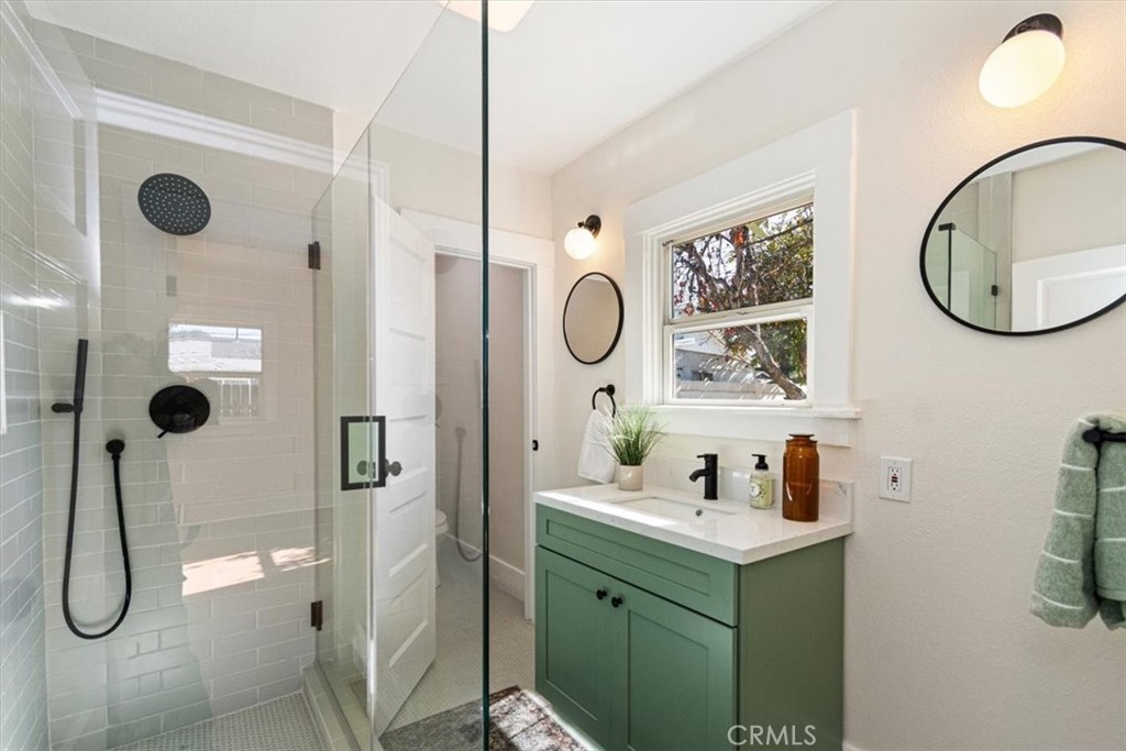 4474 Highland Place Riverside, CA 92506 - Photo 24 of 31 a bathroom with a sink and a mirror