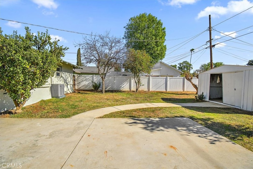 4474 Highland Place Riverside, CA 92506 - Photo 26 of 31 a view of a house with a yard and garage