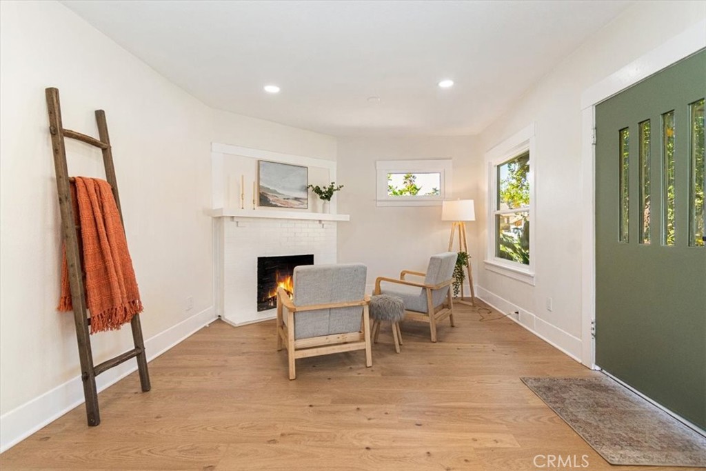 4474 Highland Place Riverside, CA 92506 - Photo 5 of 31 a living room with furniture a fireplace and a window