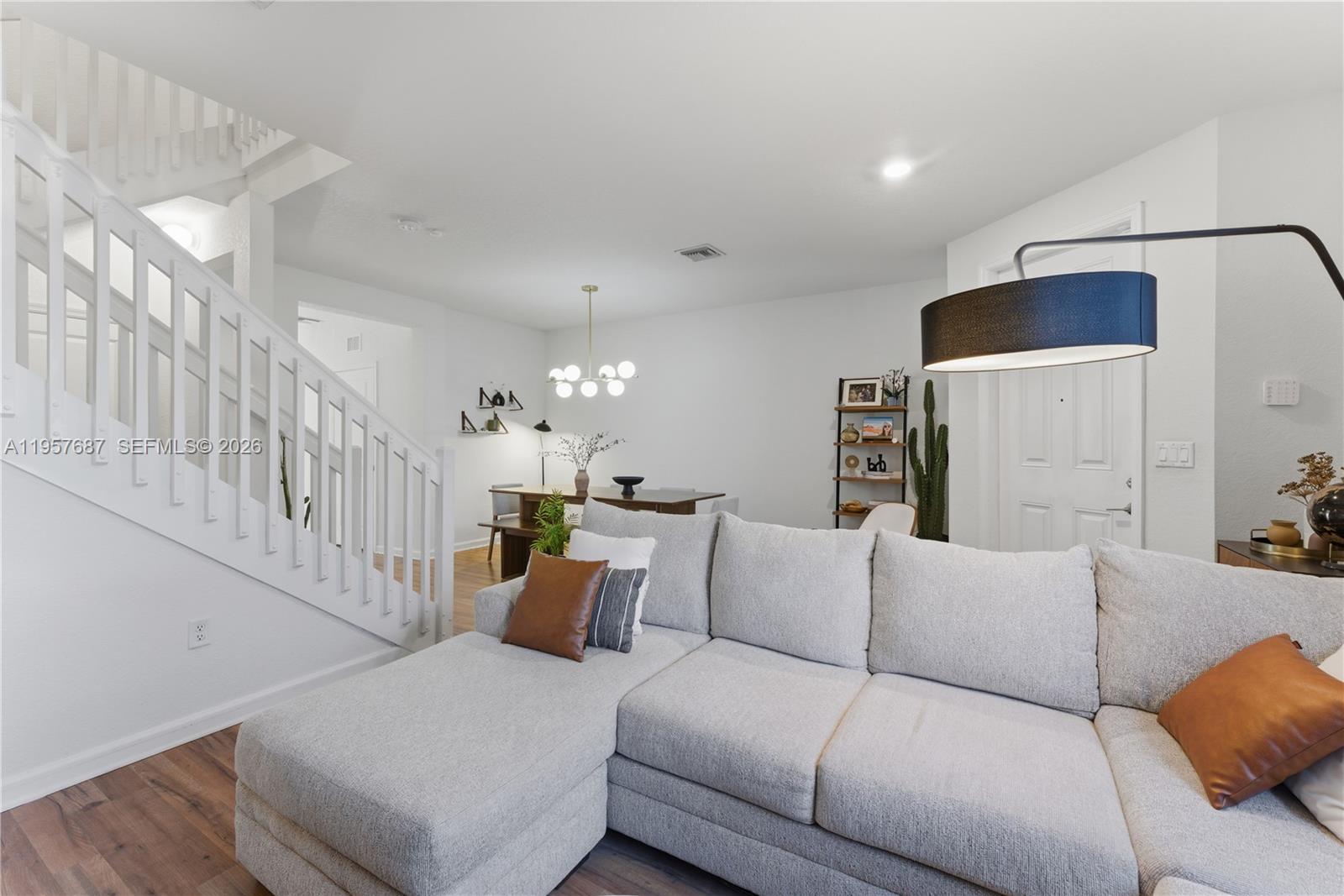 11456 West 33rd Way Hialeah, FL 33018 - Photo 2 of 49 a living room with furniture and a wooden floor