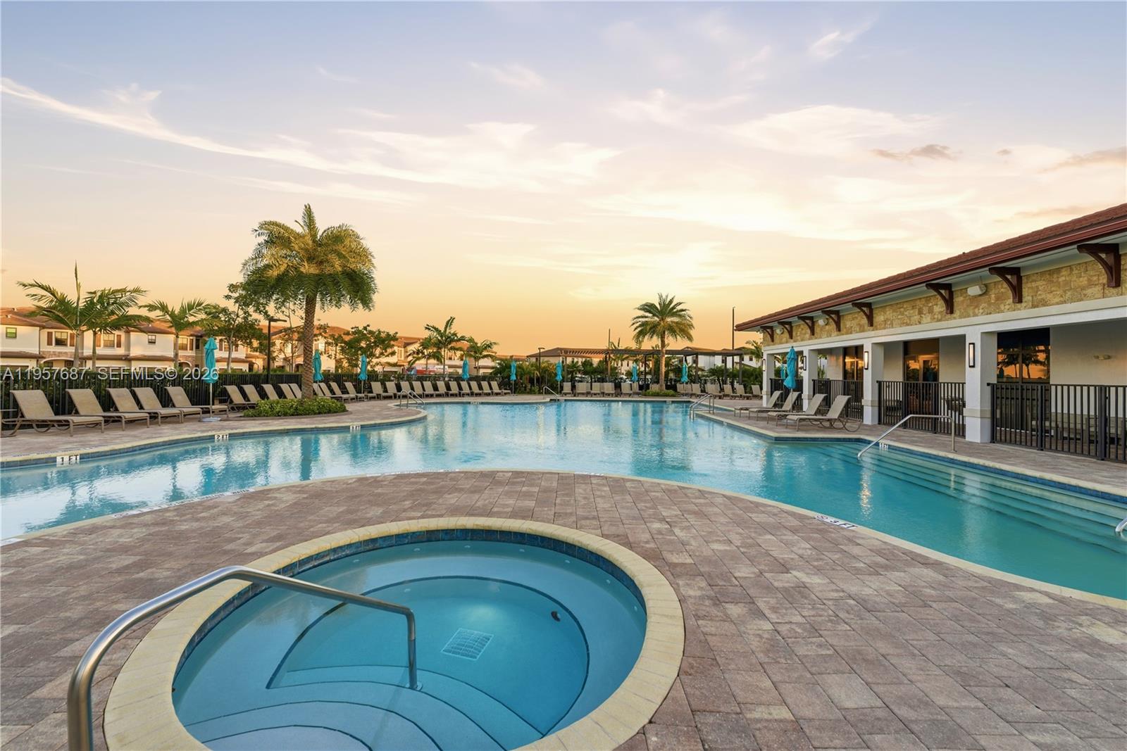 11456 West 33rd Way Hialeah, FL 33018 - Photo 30 of 49 a swimming pool with outdoor seating and lake
