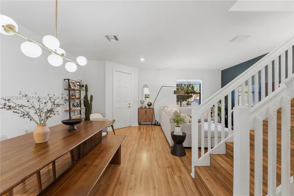 a view of a living room and wooden floor
