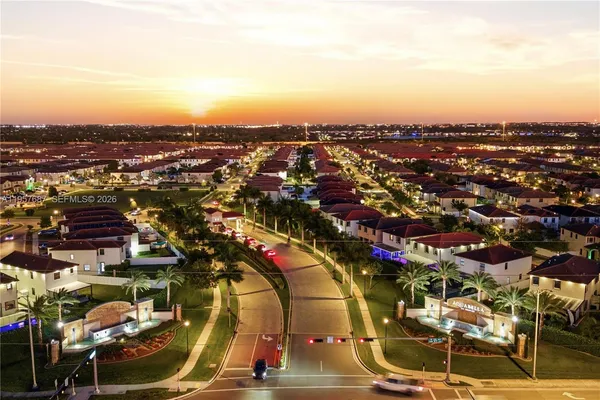 an aerial view of residential houses with city view