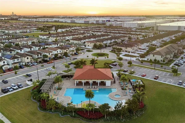an aerial view of residential houses with outdoor space