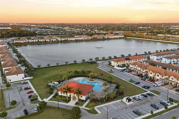 an aerial view of a city with lake view