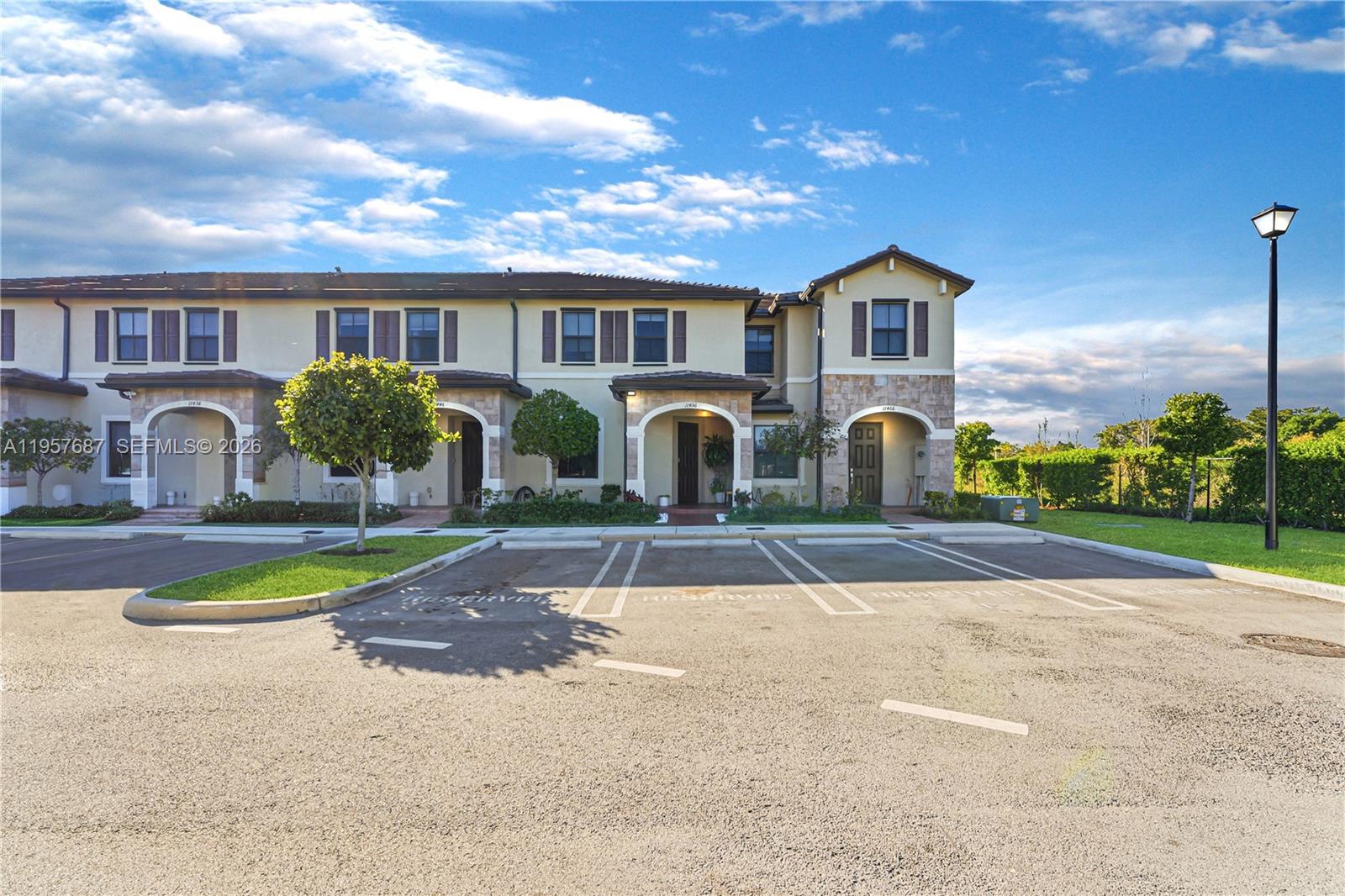 11456 West 33rd Way Hialeah, FL 33018 - Photo 47 of 49 a front view of a house with garden