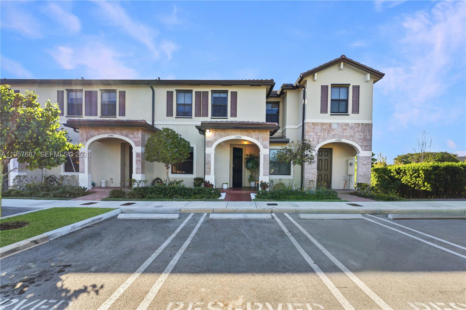 11456 West 33rd Way Hialeah, FL 33018 - Photo 10 of 49 a front view of multiple houses with yard