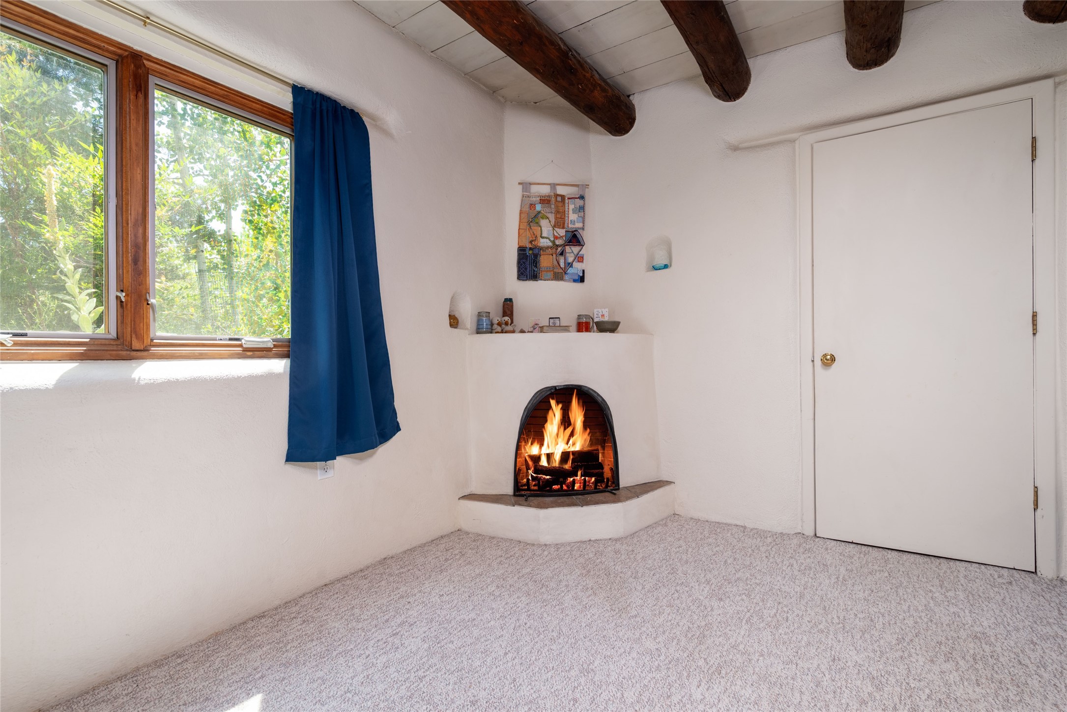 2175 Old Arroyo Chamiso Road, Unit 2 Santa Fe, NM 87505 - Photo 4 of 20 looking toward fireplace in SE corner