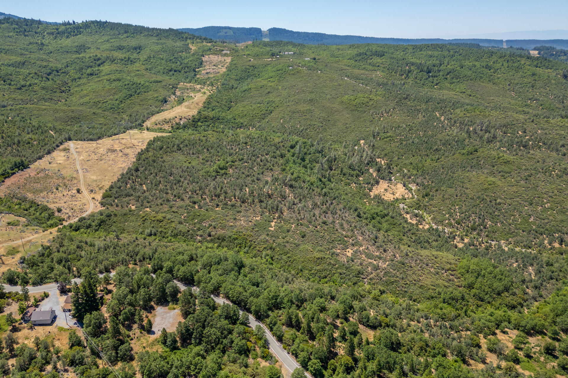 Frisby Road Round Mountain, CA 96084 - Photo 5 of 14 a view of a lush green field with an ocean view