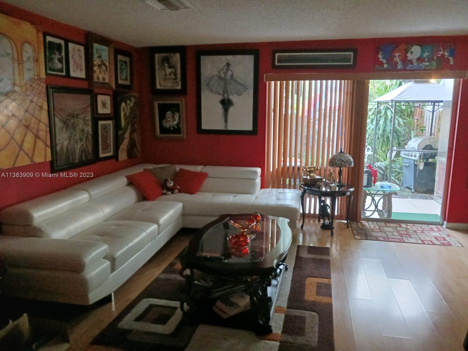 Kendale Lakes Miami, FL 33183 - Photo 2 of 5 a living room with furniture and a large window