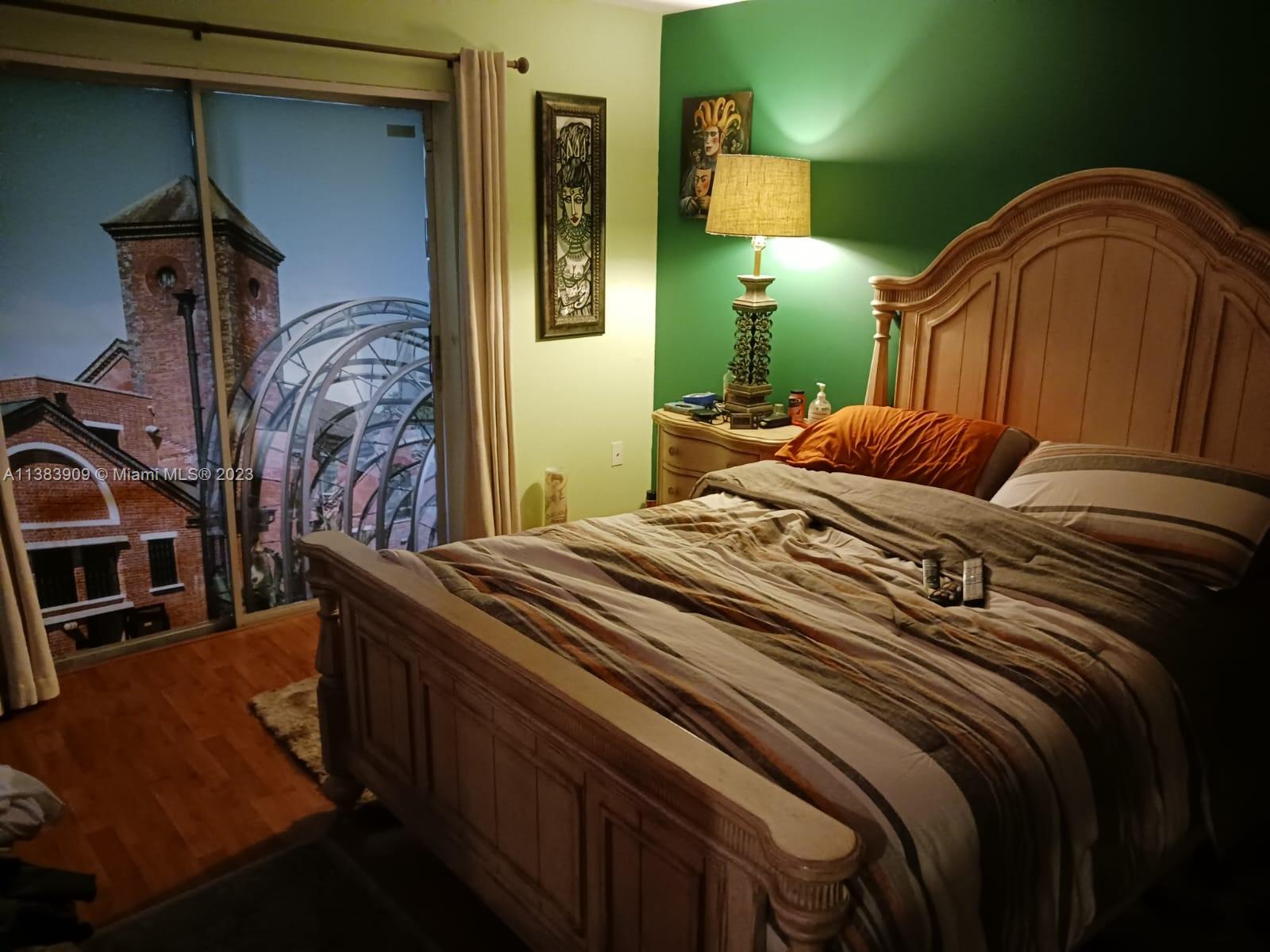 Kendale Lakes Miami, FL 33183 - Photo 5 of 5 a bedroom with a bed and a mirror