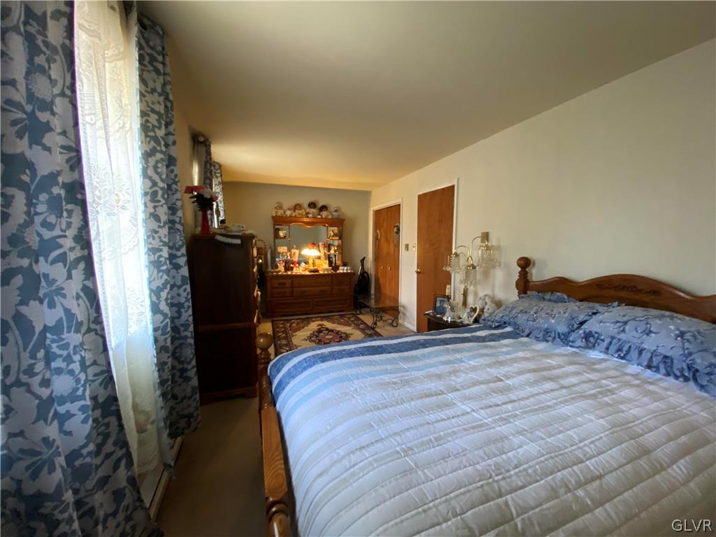 173 Skyview Circle Sciota, PA 18354 - Photo 16 of 25 a bedroom with a bed and flat screen tv