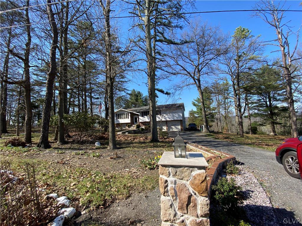173 Skyview Circle Sciota, PA 18354 - Photo 23 of 25 a street view with parked cars and trees