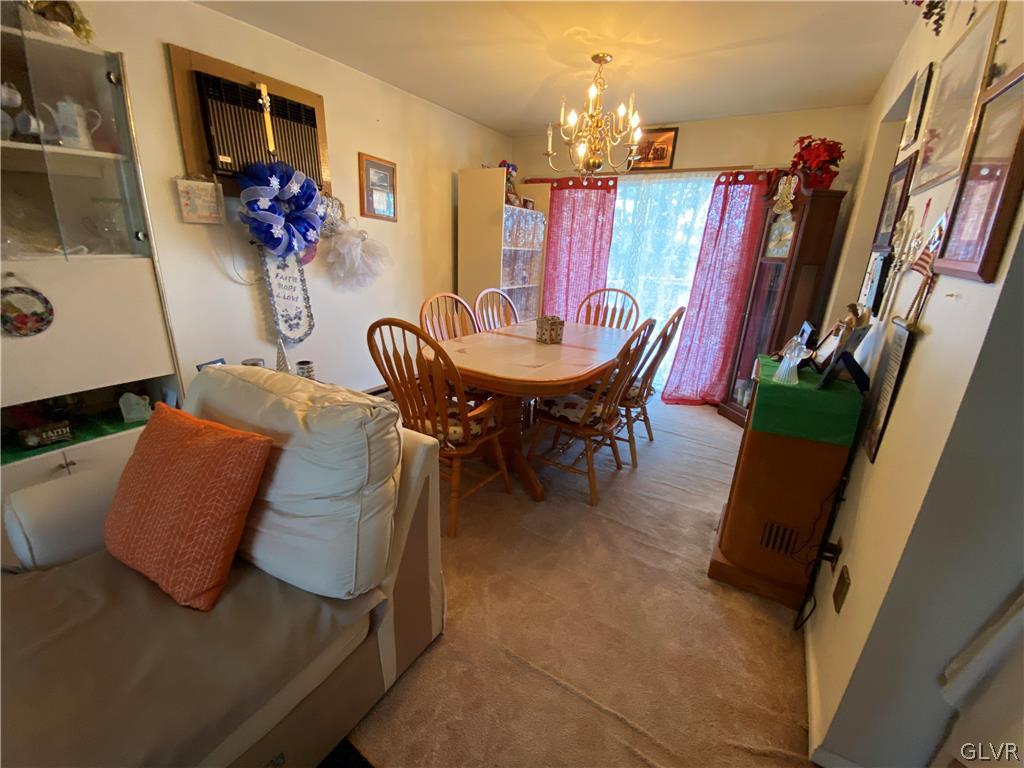 173 Skyview Circle Sciota, PA 18354 - Photo 5 of 25 a view of a dining room with furniture and a chandelier