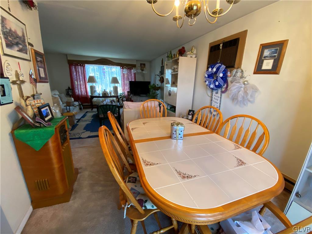 173 Skyview Circle Sciota, PA 18354 - Photo 7 of 25 a dining room with furniture a rug and wooden floor