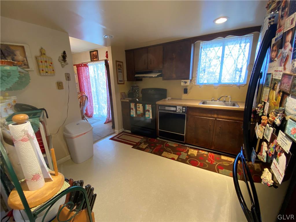 173 Skyview Circle Sciota, PA 18354 - Photo 9 of 25 a view of a kitchen with fridge and chair