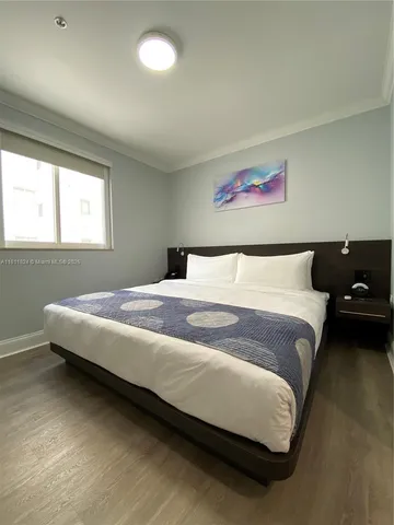 a bedroom with a bed and a couch