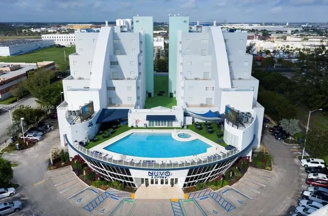 an aerial view of a house with outdoor space patio and swimming pool